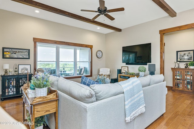 living room with beamed ceiling, recessed lighting, light wood-type flooring, and a ceiling fan