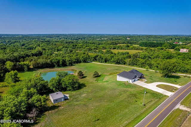 drone / aerial view featuring a view of trees