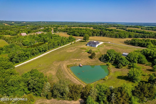 drone / aerial view with a rural view and a water view