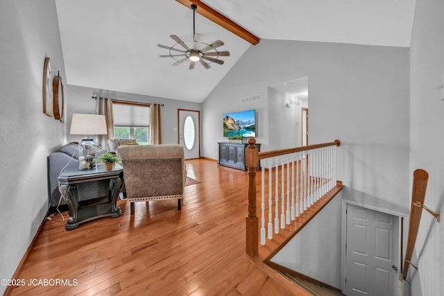 990 Diamond Rdg, Jefferson City, MO 65109 - living room featuring a ceiling fan, visible vents, high vaulted ceiling, beamed ceiling, and wood-type flooring