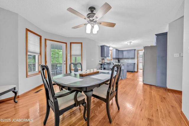 990 Diamond Rdg, Jefferson City, MO 65109 - dining room featuring baseboards, ceiling fan, light wood finished floors, and visible vents