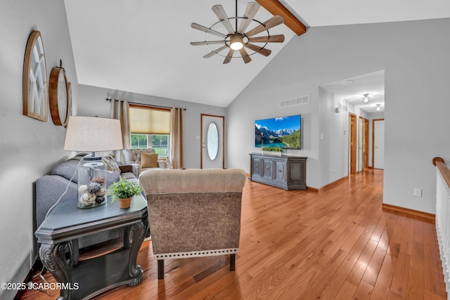 990 Diamond Rdg, Jefferson City, MO 65109 - living room with visible vents, beam ceiling, high vaulted ceiling, light wood-type flooring, and a ceiling fan