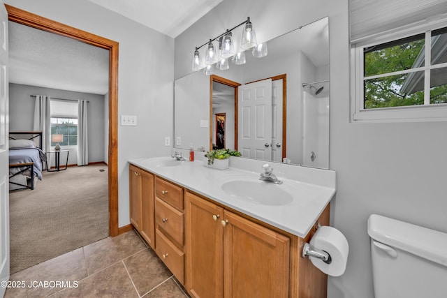 990 Diamond Rdg, Jefferson City, MO 65109 - full bathroom featuring a sink, tile patterned floors, toilet, and double vanity