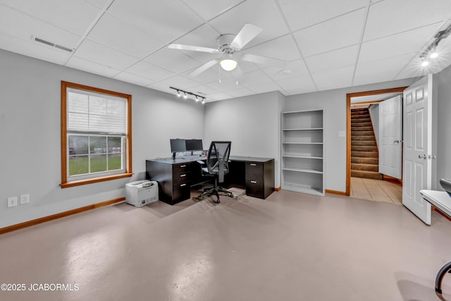 990 Diamond Rdg, Jefferson City, MO 65109 - home office featuring concrete flooring, built in features, baseboards, a drop ceiling, and visible vents