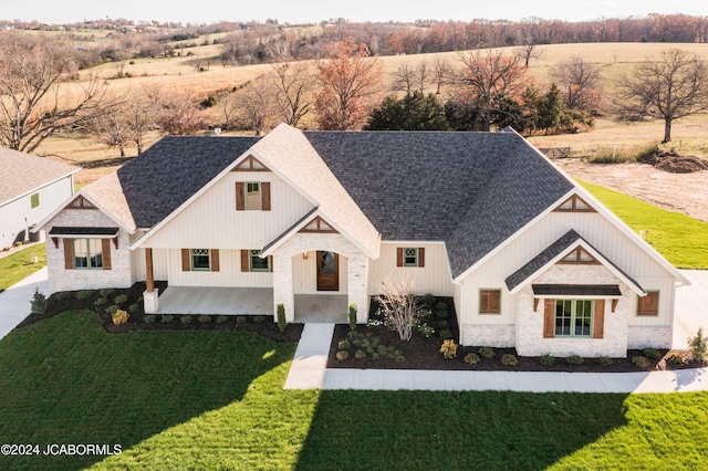 modern inspired farmhouse featuring a patio and a front yard