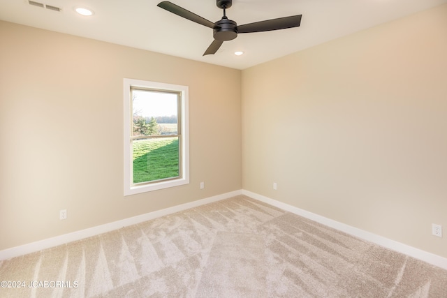 carpeted empty room with ceiling fan