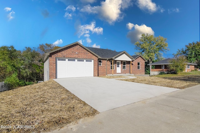 ranch-style house featuring a garage