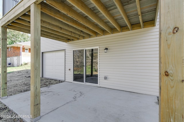 view of patio / terrace featuring a garage