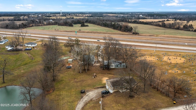 drone / aerial view featuring a water view and a rural view