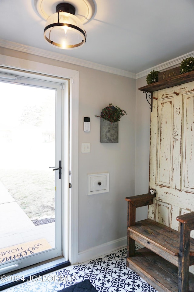 doorway featuring ornamental molding