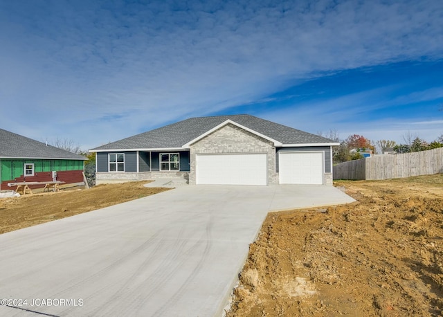 ranch-style house featuring a garage