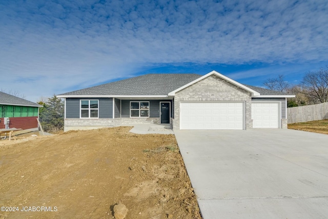 single story home with a garage