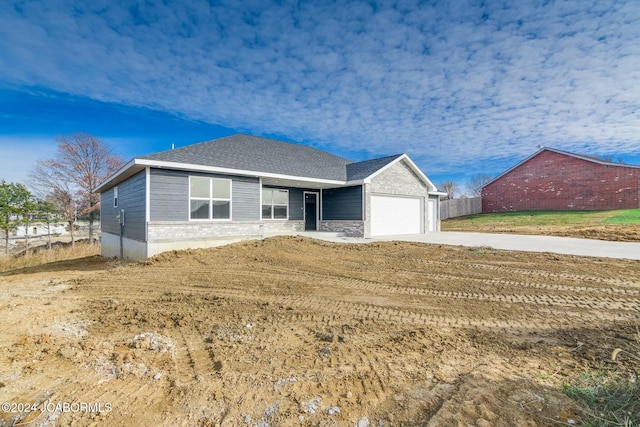 single story home featuring a garage