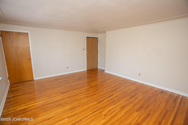 210 E Dunklin St, Jefferson City, MO 65101 - unfurnished room with light wood-style flooring and baseboards