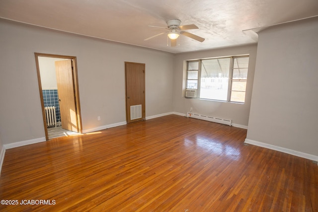 210 E Dunklin St, Jefferson City, MO 65101 - unfurnished room featuring a baseboard radiator, ceiling fan, wood finished floors, and baseboards