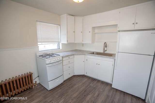 210 E Dunklin St, Jefferson City, MO 65101 - kitchen featuring white appliances, radiator heating unit, a sink, open shelves, and white cabinetry