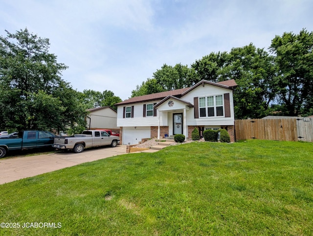 5416 S Brooks Dr, Jefferson City, MO 65109 - bi-level home featuring driveway, an attached garage, and brick siding