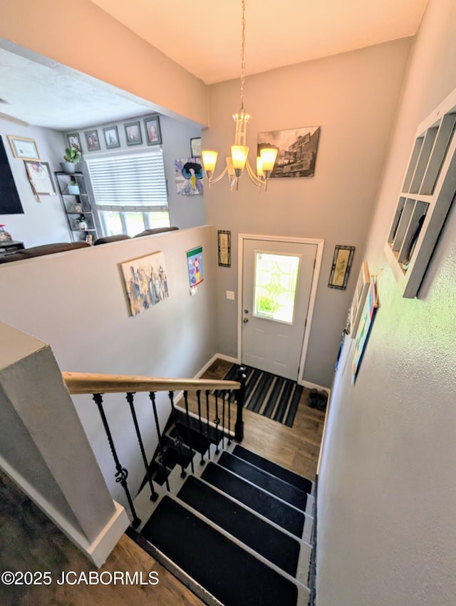 5416 S Brooks Dr, Jefferson City, MO 65109 - stairway featuring a chandelier and wood finished floors