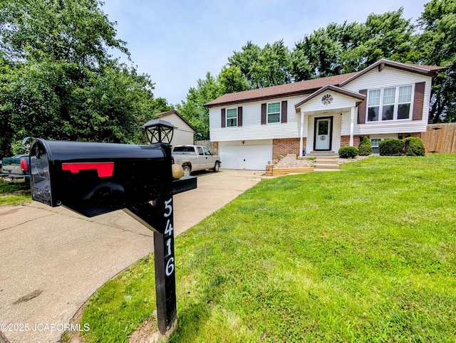 5416 S Brooks Dr, Jefferson City, MO 65109 - raised ranch with concrete driveway, brick siding, and an attached garage
