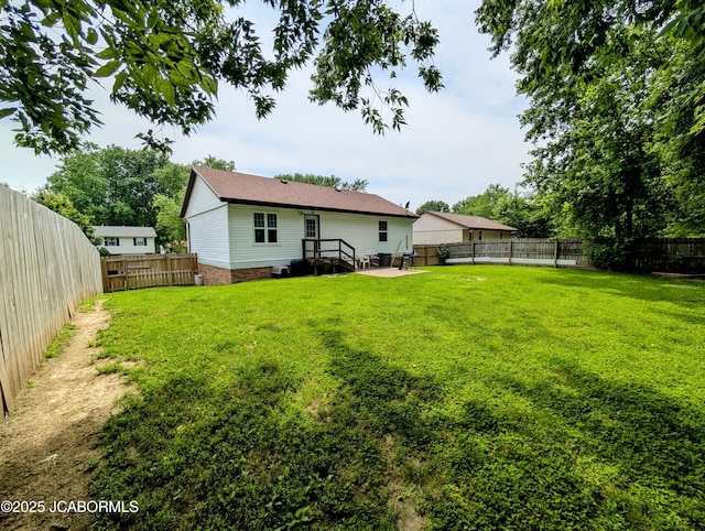 5416 S Brooks Dr, Jefferson City, MO 65109 - rear view of house featuring a fenced backyard