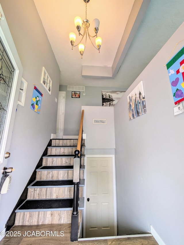 5416 S Brooks Dr, Jefferson City, MO 65109 - stairs with a chandelier