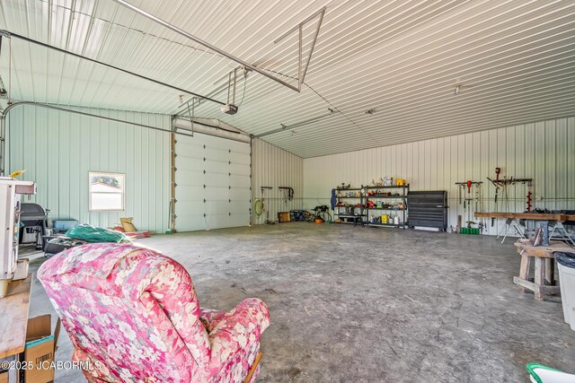 4604 County Rd 115, Fulton, MO 65251 - garage with metal wall and a garage door opener