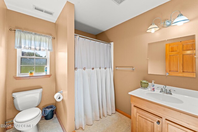 4604 County Rd 115, Fulton, MO 65251 - full bathroom with toilet, vanity, curtained shower, baseboards, and tile patterned floors