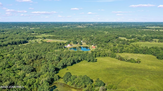4604 County Rd 115, Fulton, MO 65251 - aerial view of property and surrounding area with a heavily wooded area
