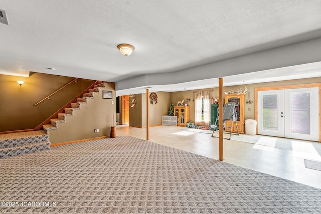 4604 County Rd 115, Fulton, MO 65251 - basement with stairs, a textured ceiling, french doors, tile patterned floors, and baseboards
