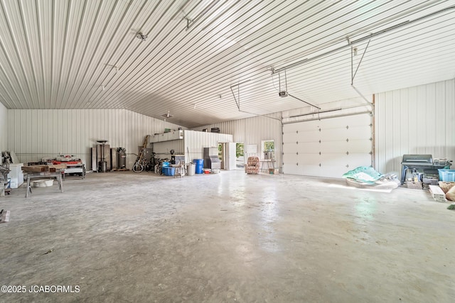 4604 County Rd 115, Fulton, MO 65251 - garage with metal wall and a garage door opener