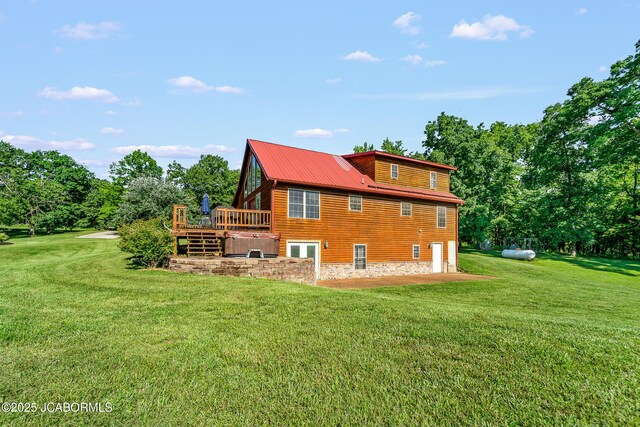 4604 County Rd 115, Fulton, MO 65251 - back of property featuring a lawn, a deck, and a garage