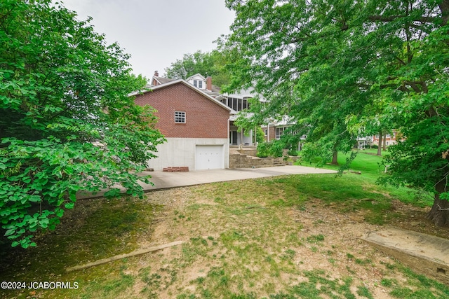 view of yard with a garage