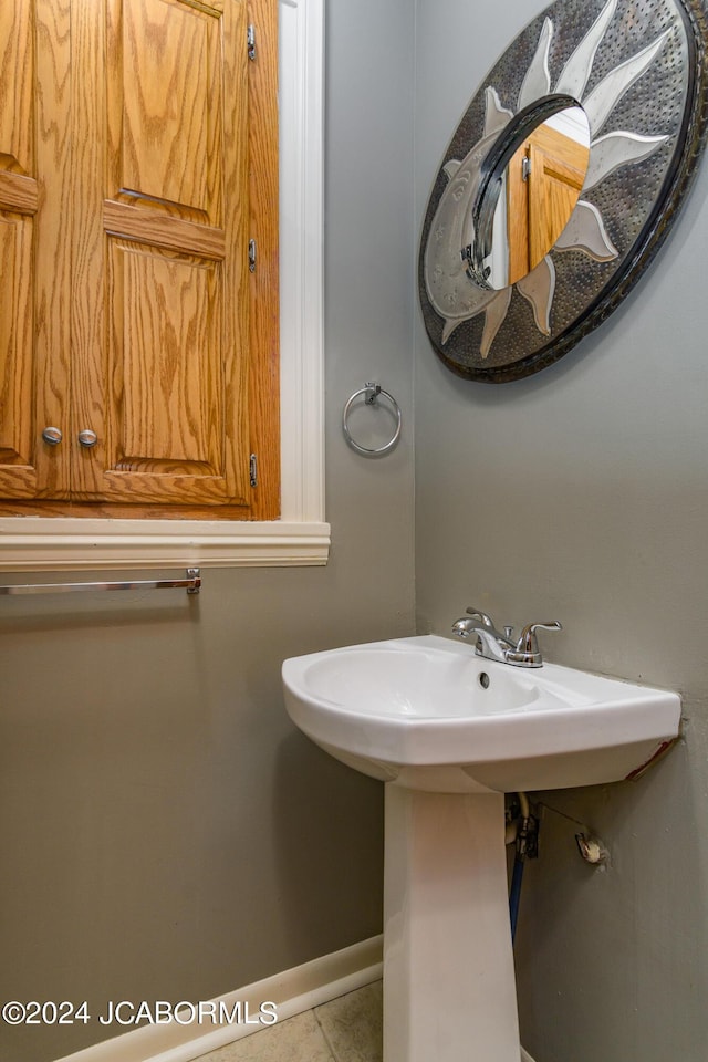 bathroom featuring tile patterned floors and sink