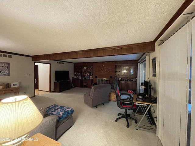 700 S Bowling St, California, MO 65018 - living area featuring a textured ceiling, carpet, and crown molding