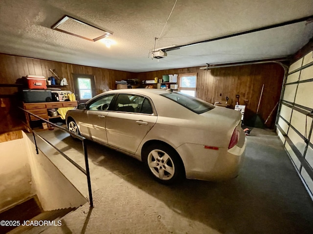 700 S Bowling St, California, MO 65018 - garage with wooden walls and a garage door opener