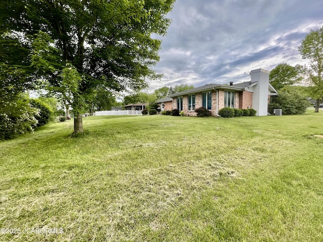 700 S Bowling St, California, MO 65018 - view of green lawn featuring central AC unit