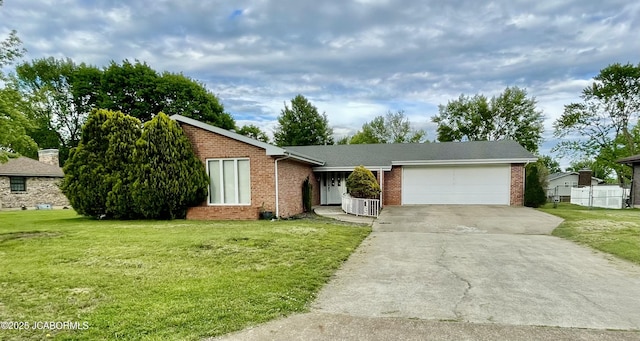 700 S Bowling St, California, MO 65018 - view of front facade with a garage, brick siding, and concrete driveway