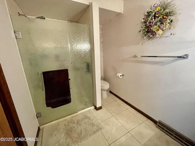 700 S Bowling St, California, MO 65018 - bathroom featuring a stall shower, toilet, tile patterned floors, and baseboards