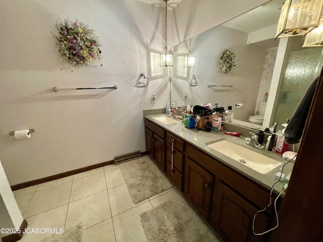 700 S Bowling St, California, MO 65018 - full bathroom with toilet, double vanity, and tile patterned flooring