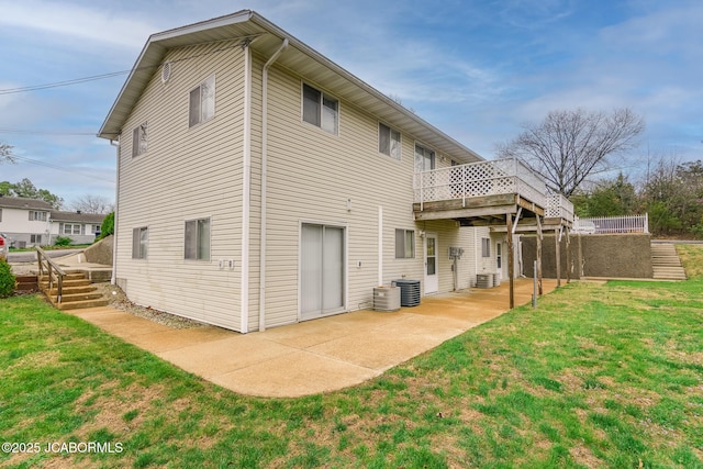 back of property featuring a lawn, a deck, a patio, and central AC