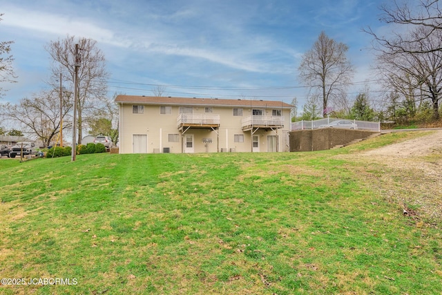 back of house with a yard