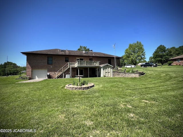 12566 Country View Dr, Tebbetts, MO 65080 - back of property with stairway, a garage, brick siding, and a yard