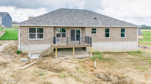 209 Gavin Ln, Linn, MO 65051 - back of house featuring a wooden deck, brick siding, and roof with shingles