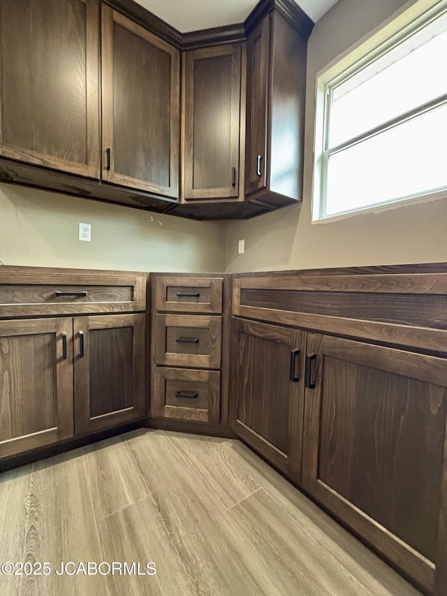 209 Gavin Ln, Linn, MO 65051 - kitchen featuring dark brown cabinetry and light wood-type flooring