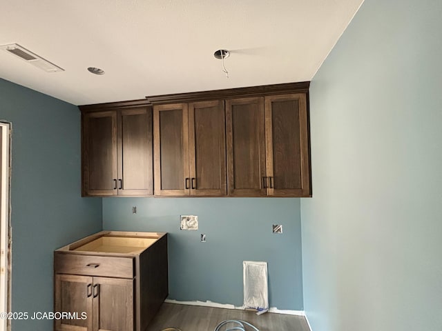209 Gavin Ln, Linn, MO 65051 - laundry room featuring dark wood finished floors