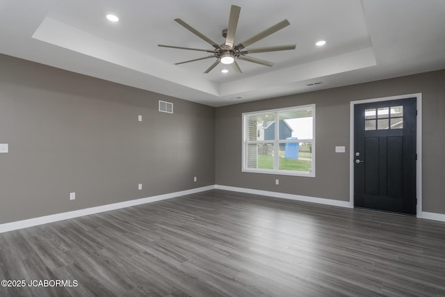 209 Gavin Ln, Linn, MO 65051 - foyer featuring a tray ceiling, ceiling fan, healthy amount of natural light, recessed lighting, and dark wood-style floors