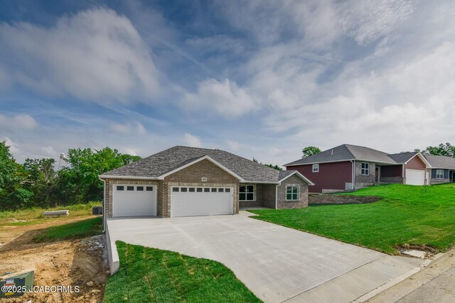 209 Gavin Ln, Linn, MO 65051 - ranch-style home with a garage, concrete driveway, a front lawn, and brick siding