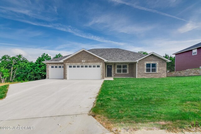 209 Gavin Ln, Linn, MO 65051 - single story home featuring a garage, driveway, a front yard, and brick siding