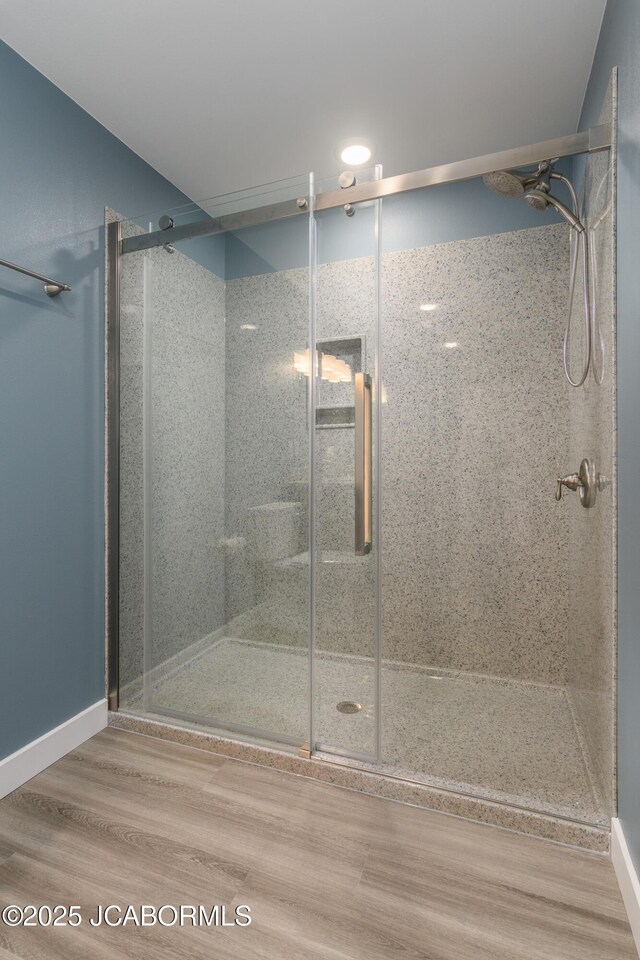 209 Gavin Ln, Linn, MO 65051 - full bathroom featuring a stall shower and wood finished floors
