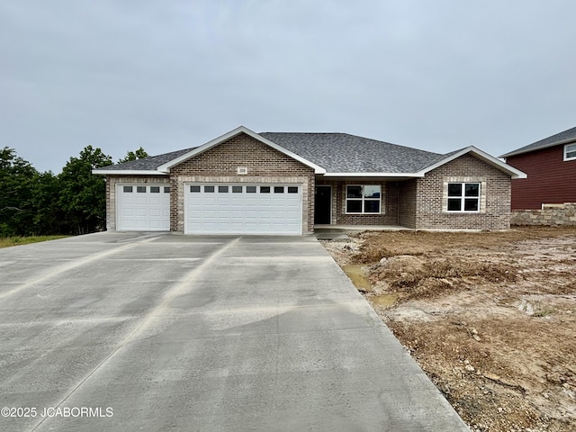 209 Gavin Ln, Linn, MO 65051 - ranch-style home featuring an attached garage, driveway, brick siding, and a shingled roof
